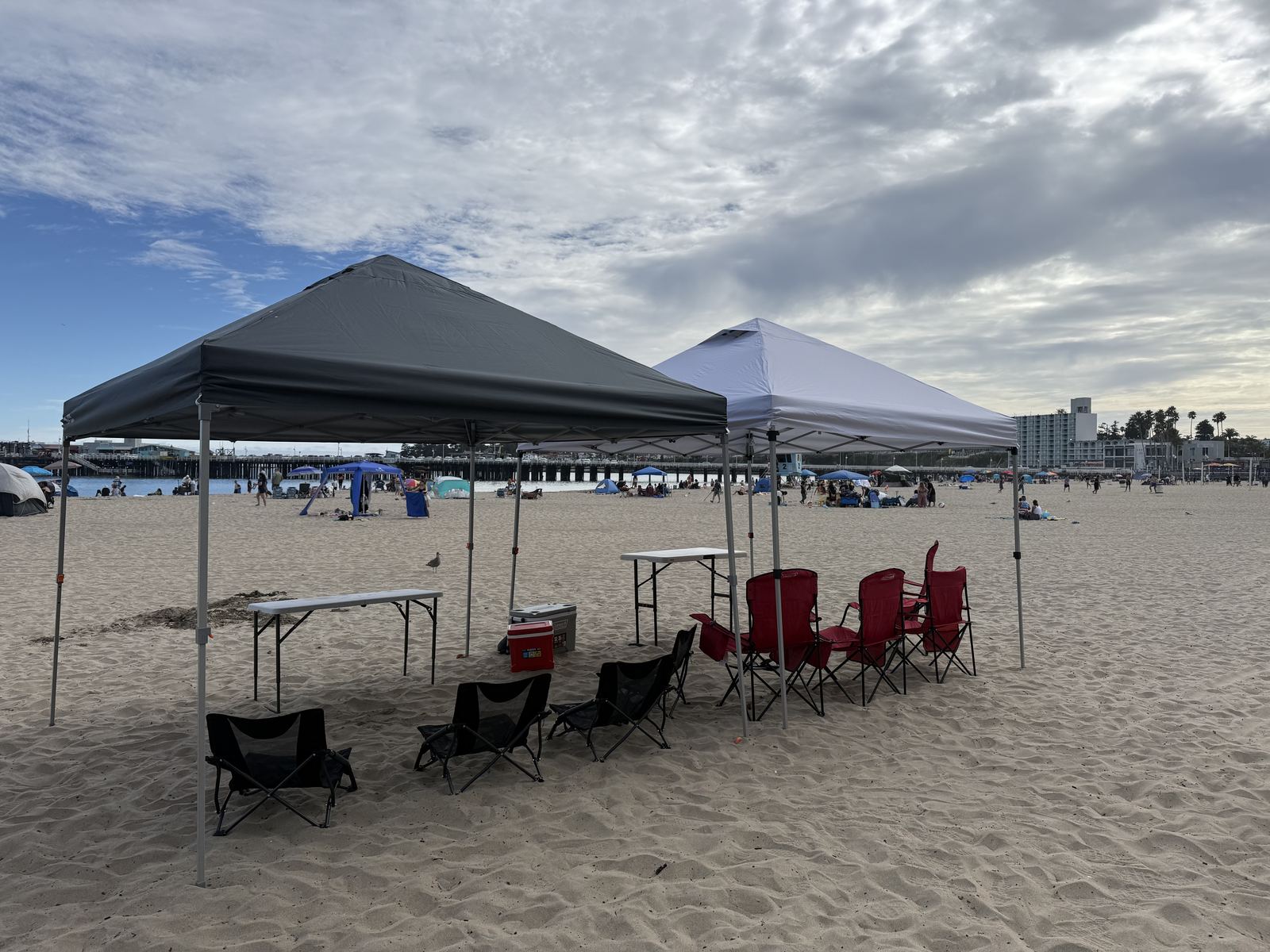 Two full cabana setups side by side on Santa Cruz beach